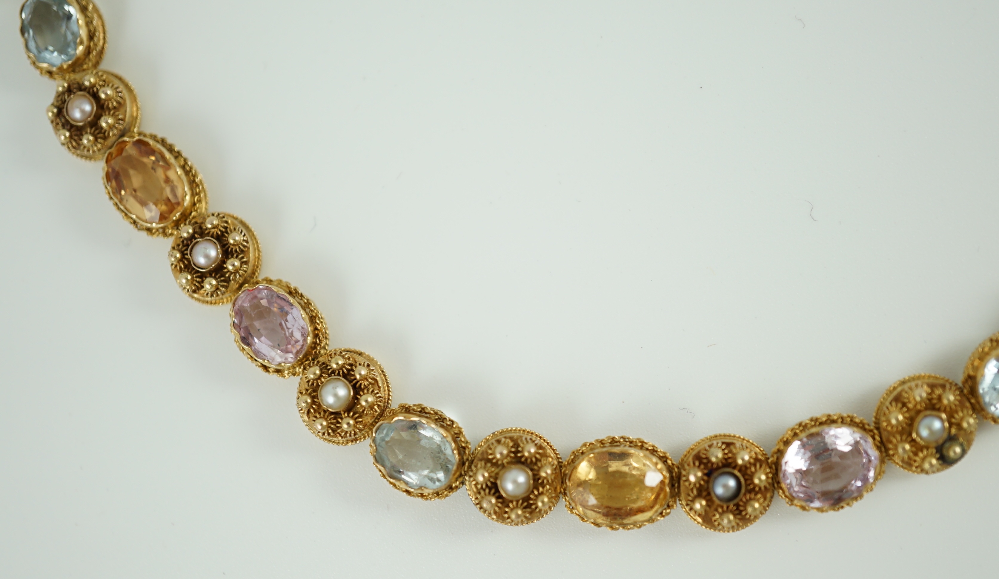 A 19th century gold, pink topaz, seed pearl, citrine and aquamarine set choker necklace